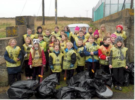 Photograph of Young litter pickers get busy sprucing up their village 